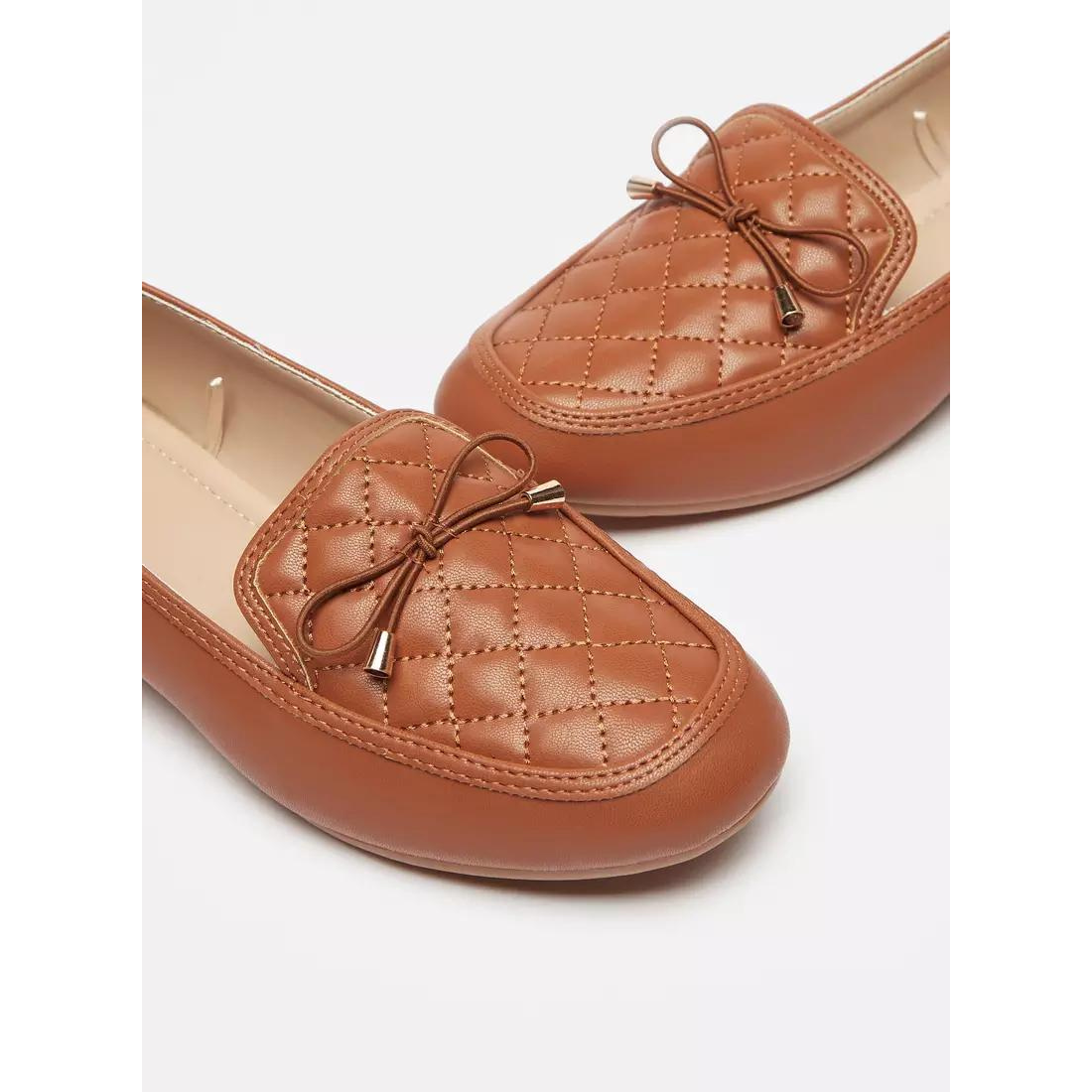 Tan Quilted Slip-On Moccasins with Bow Trim